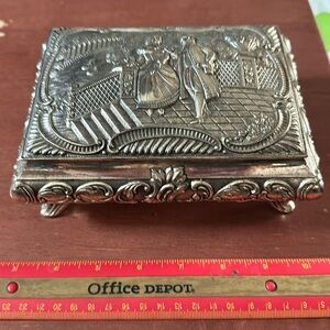 Vintage large silver colored ornate Jewelry Box. Used and shows normal wear.